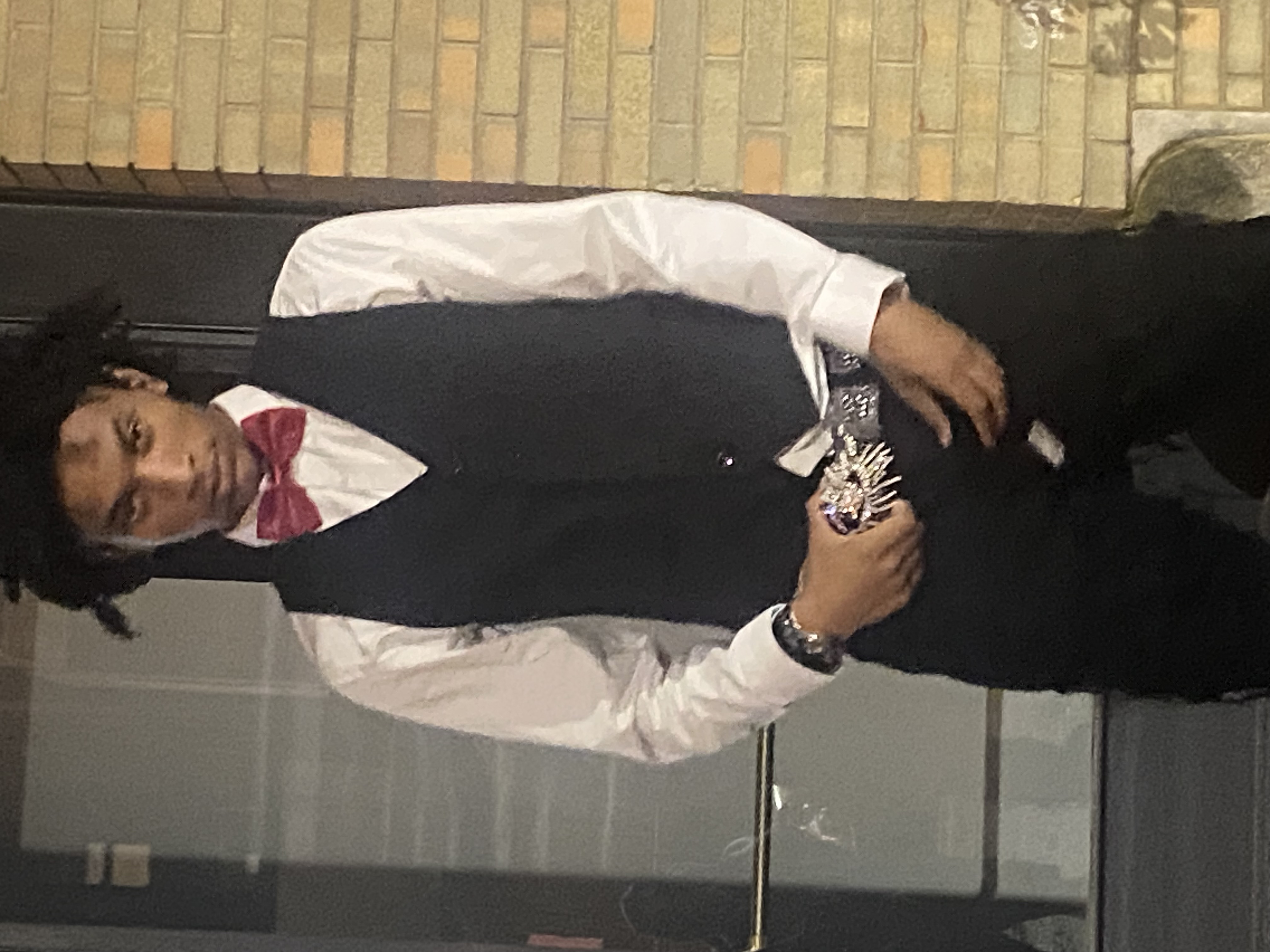 Original portrait reference image of son in formal wear.